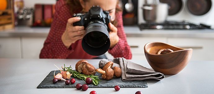 woman-food-photographer-taking-closeup-of-mushrooms