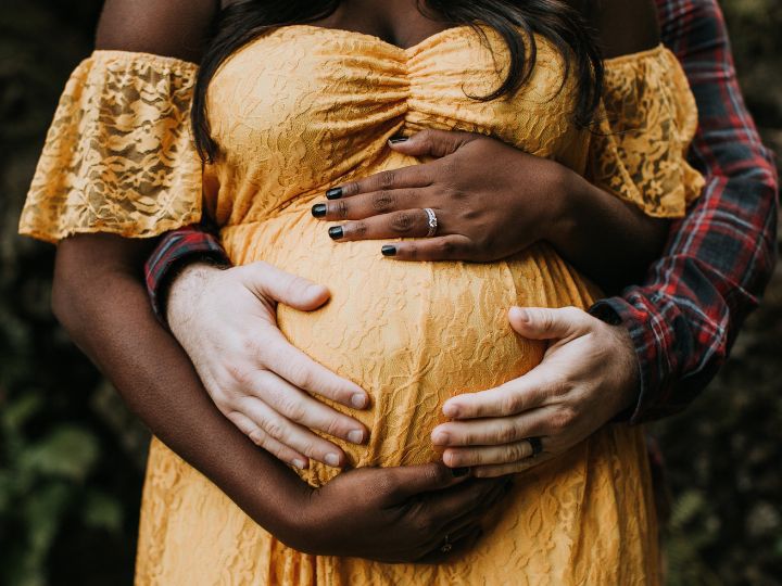 A Pregnant Indian Lady Poses for Outdoor Pregnancy Shoot and Hands