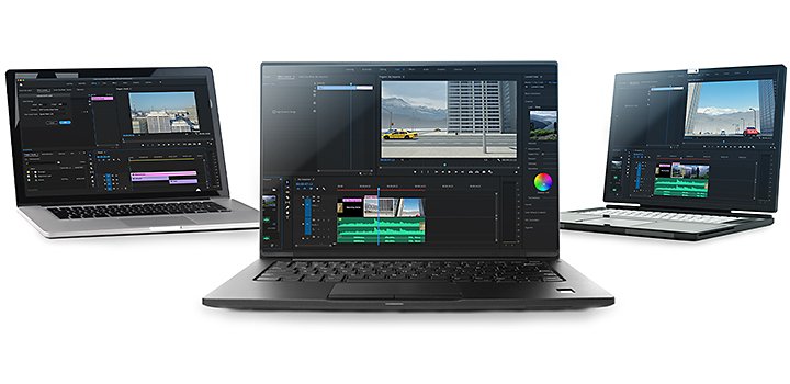 Three laptops side by side with video editing software on their screens