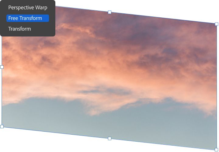 Orange clouds and a dull blue sky is transformed using the Free Transform tool in Adobe Photoshop