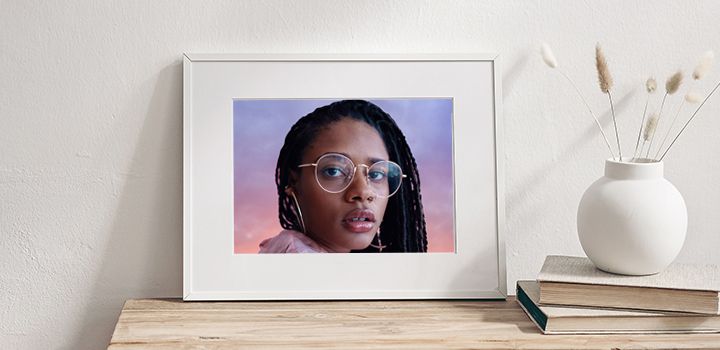 Edited image of a person with glasses in white frame on a shelf