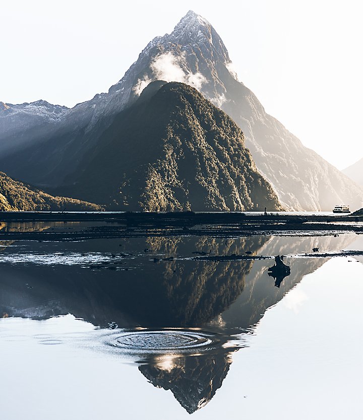A mountain reflected in a body of water